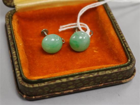 A pair of white metal mounted cabochon jadeite earrings with Gem & Peal Laboratory certificate dated 2016.